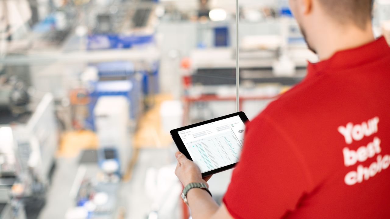 man looking at tablet