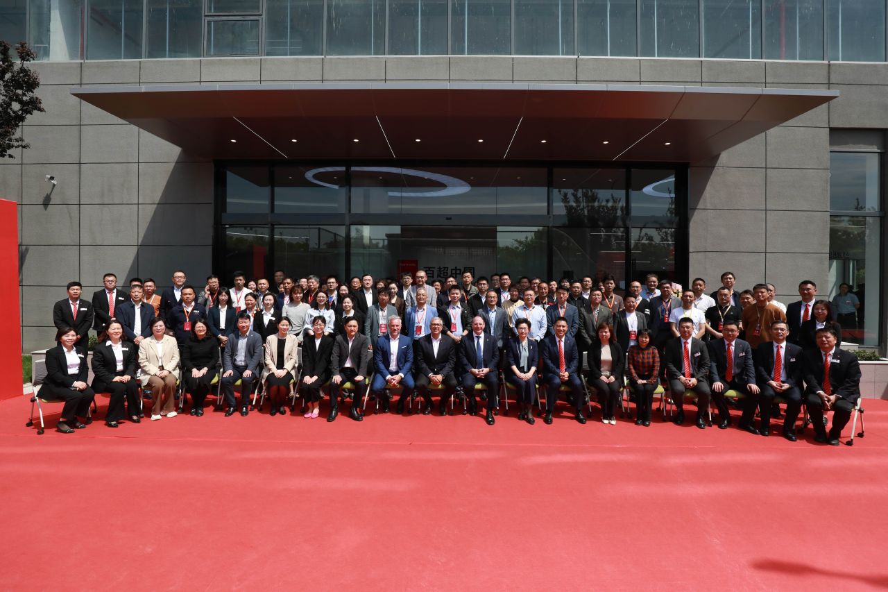 Group of people in front of Bystronic China's new building