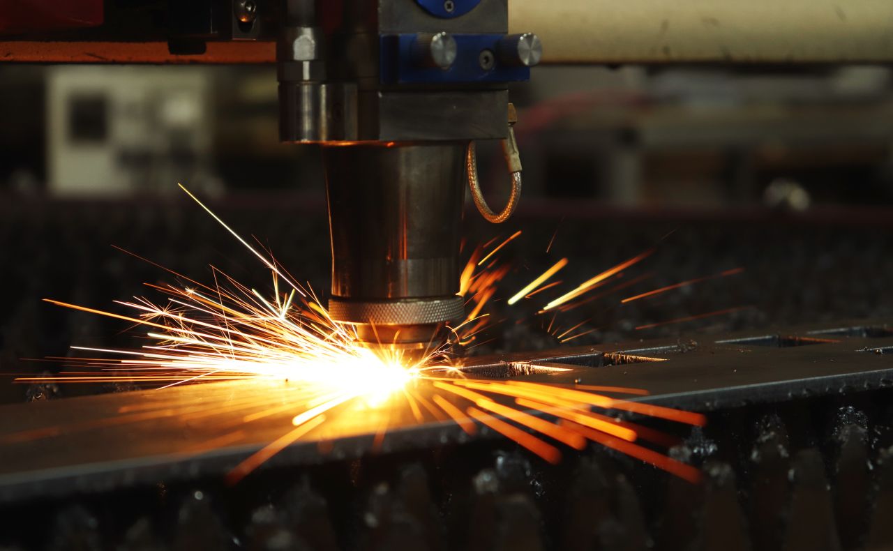 a laser cutting into metal