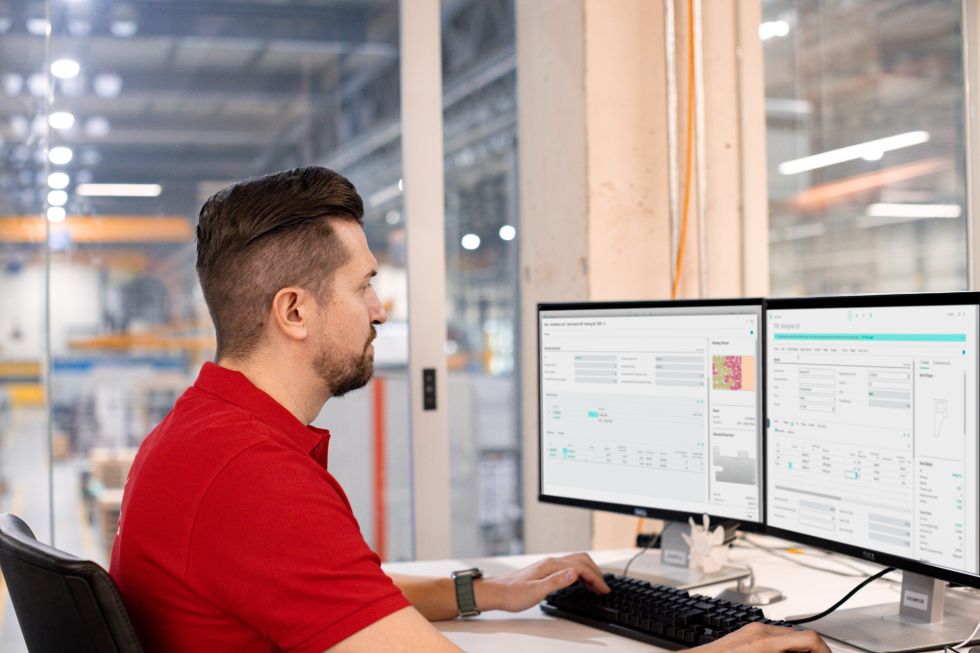 man looking at monitor