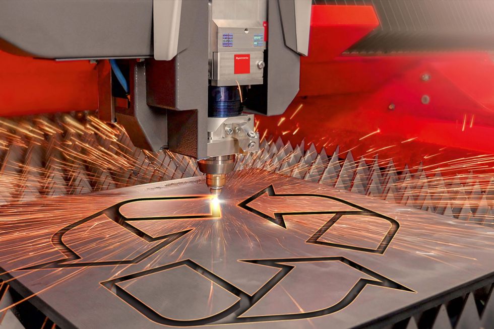 Bystronic laser cutting a recycle symbol on sheet metal