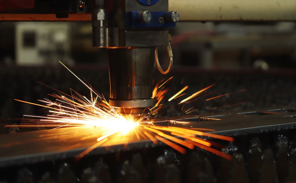 a laser cutting into metal
