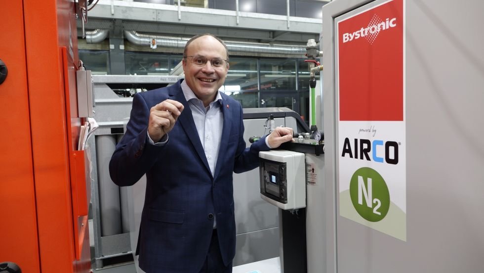 Philipp Burgener, Managing Director of Bystronic Sales AG, in front of the nitrogen generator in the Experience Center in Niederönz, Switzerland.