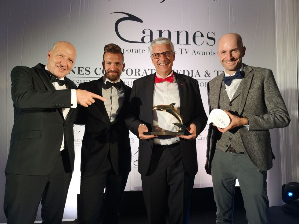 Accepting the Golden Dolphin in Cannes: Peter Beck (Creative Director), Daniel Moreno (Head of Corporate Branding), Jean-Pierre Neuhaus (Head of Corporate Communications), Andy Weimer (Post Production)  