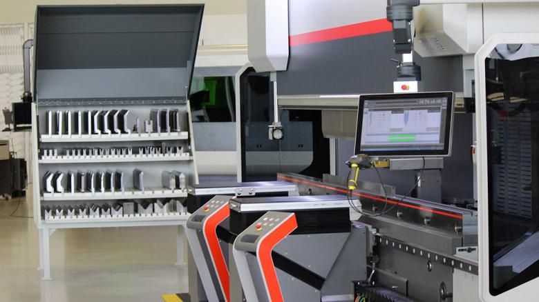 Figure 1.  With tooling organized nearby, this press brake allows a technician to accept parts coming off the laser, scan them in, download the program, and keep the flow going. 